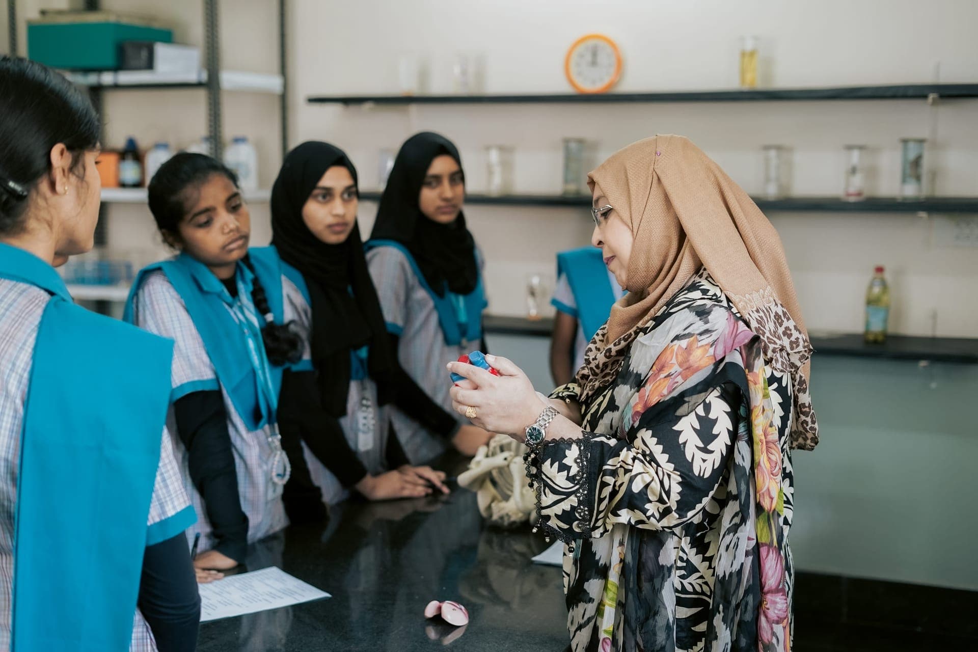 High-school students observing a science demonstration in the lab